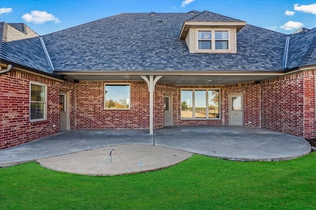 rear view of property featuring a patio