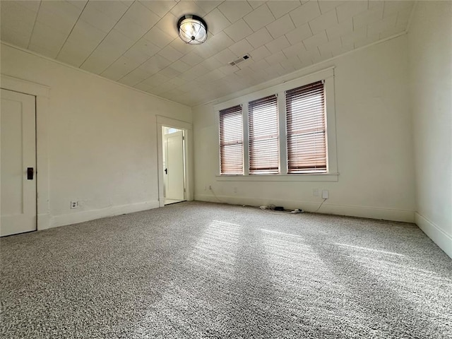 spare room featuring carpet floors