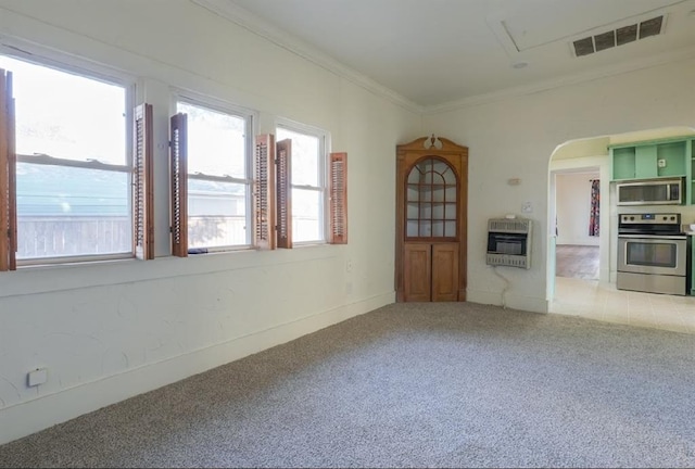 unfurnished living room with light carpet, heating unit, and ornamental molding