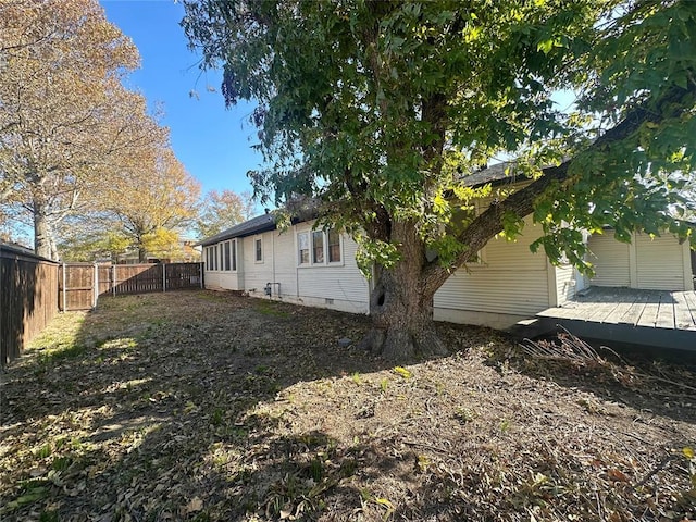 view of side of property with a deck