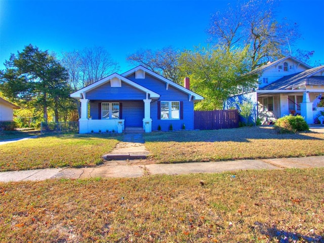 view of front of property with a front lawn and covered porch