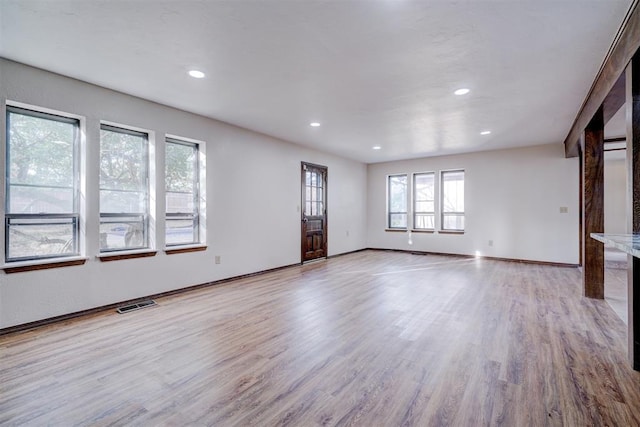 unfurnished living room with light wood-type flooring