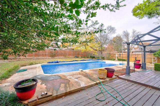 view of pool featuring a wooden deck