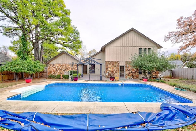 view of swimming pool with a patio