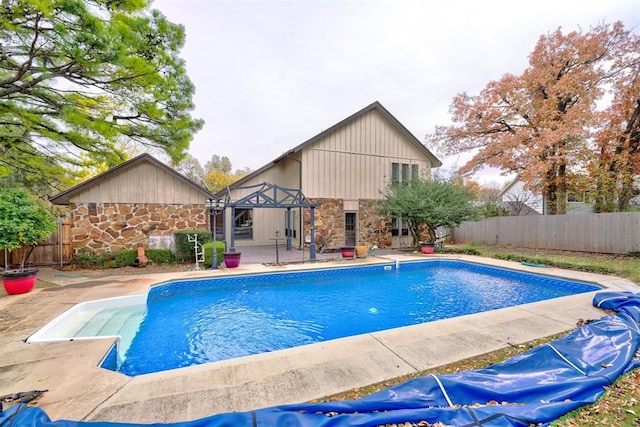 view of swimming pool featuring a patio area