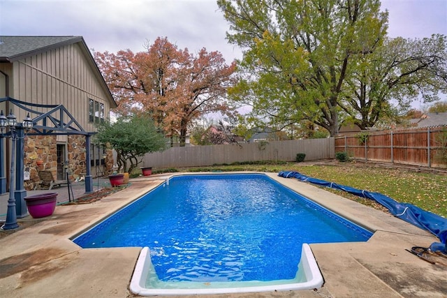 view of swimming pool with a patio area, a fenced backyard, and a fenced in pool