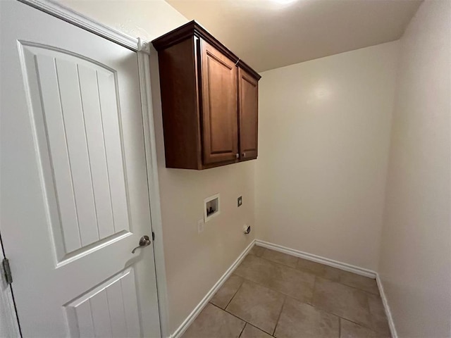 laundry area with cabinets, washer hookup, light tile patterned floors, and electric dryer hookup