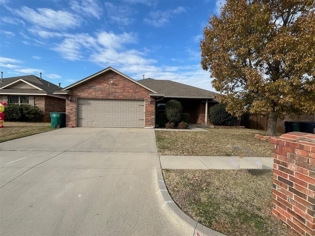 ranch-style house featuring a garage