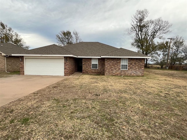 ranch-style home with a front yard and a garage