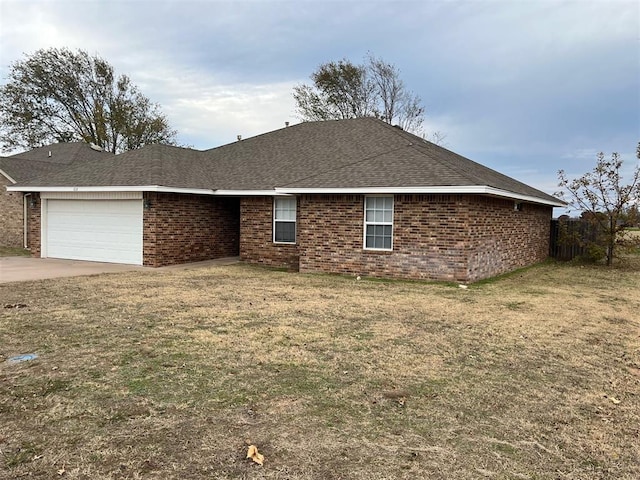 view of property exterior featuring a yard and a garage