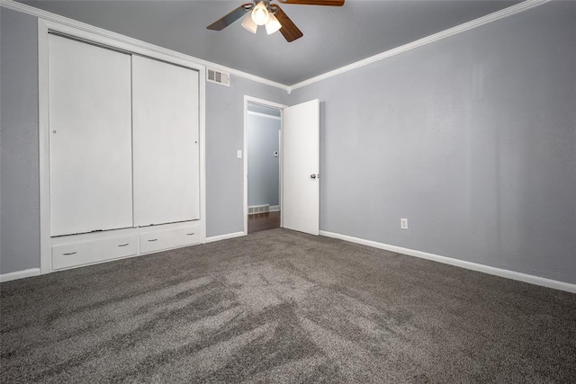 unfurnished bedroom featuring ceiling fan, carpet, and ornamental molding