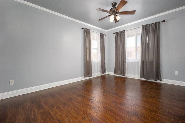 empty room with ornamental molding, dark hardwood / wood-style flooring, and ceiling fan