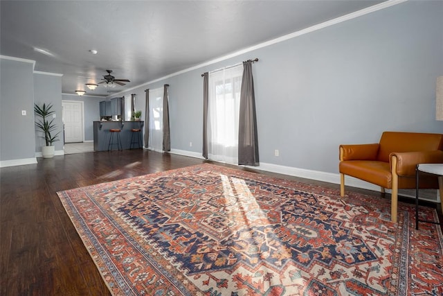 2100 Barclay Rd, Oklahoma City, OK 73120 - living area with ceiling fan, crown molding, wood-type flooring, and baseboards