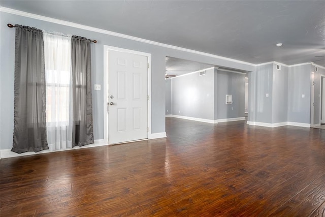 2100 Barclay Rd, Oklahoma City, OK 73120 - unfurnished living room featuring ornamental molding, baseboards, and wood finished floors