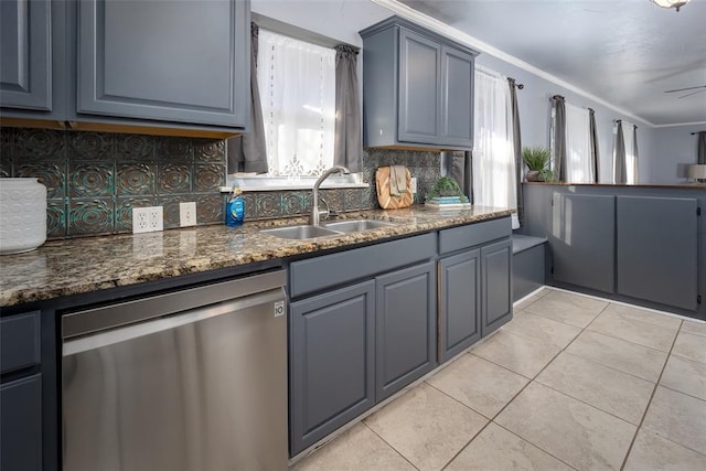 2100 Barclay Rd, Oklahoma City, OK 73120 - kitchen featuring dishwasher, a sink, backsplash, light tile patterned flooring, and dark stone countertops