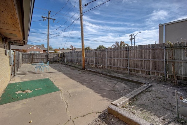 2100 Barclay Rd, Oklahoma City, OK 73120 - fenced backyard with a patio area