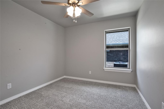 carpeted empty room featuring ceiling fan