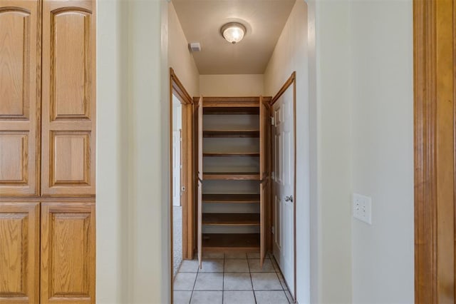 walk in closet featuring light tile patterned floors