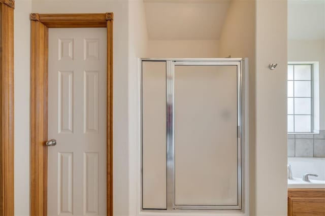 bathroom with separate shower and tub