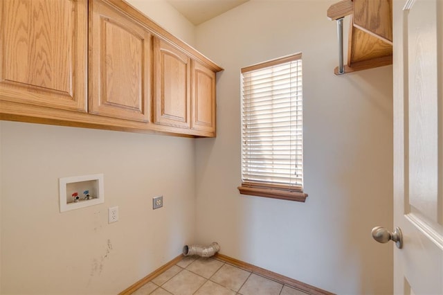 clothes washing area with electric dryer hookup, light tile patterned floors, cabinets, and washer hookup