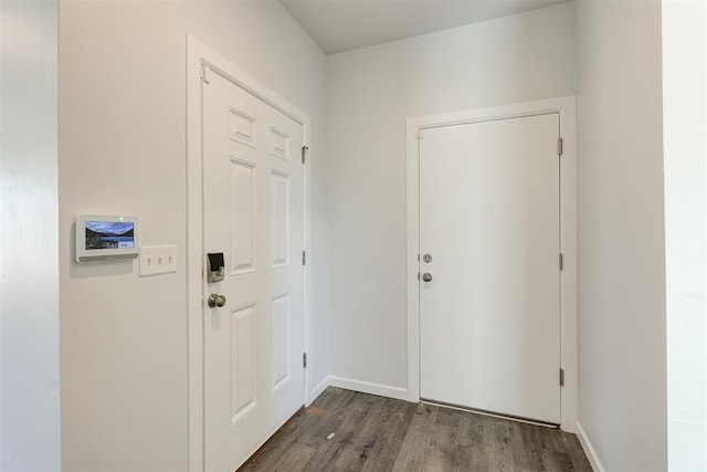 doorway to outside with dark hardwood / wood-style flooring