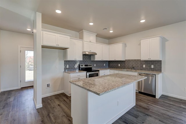 kitchen with white cabinetry, a center island, dark wood-type flooring, and appliances with stainless steel finishes