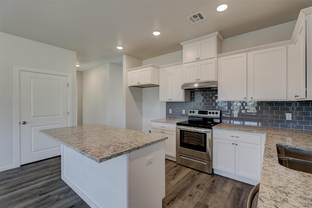 kitchen featuring dark wood-type flooring, tasteful backsplash, light stone counters, stainless steel electric stove, and white cabinets