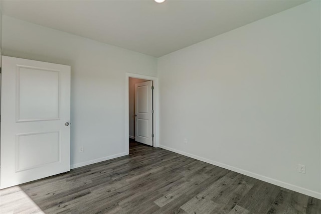 unfurnished bedroom with hardwood / wood-style flooring