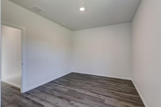 unfurnished room featuring dark hardwood / wood-style floors