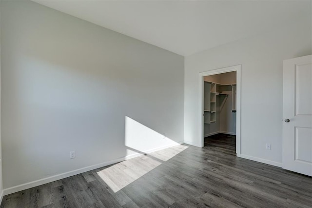 spare room with dark hardwood / wood-style floors