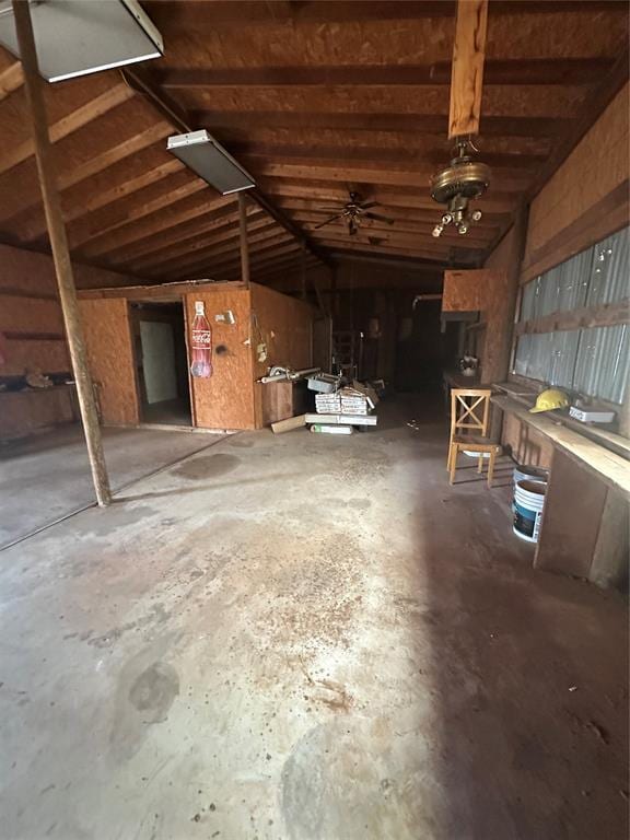 misc room with vaulted ceiling with beams