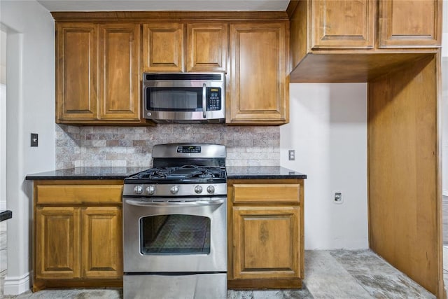 kitchen featuring dark stone counters, tasteful backsplash, and stainless steel appliances