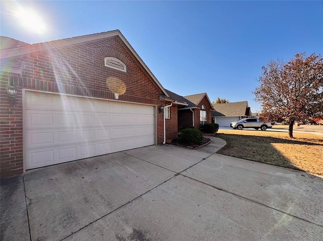 view of side of home with a garage