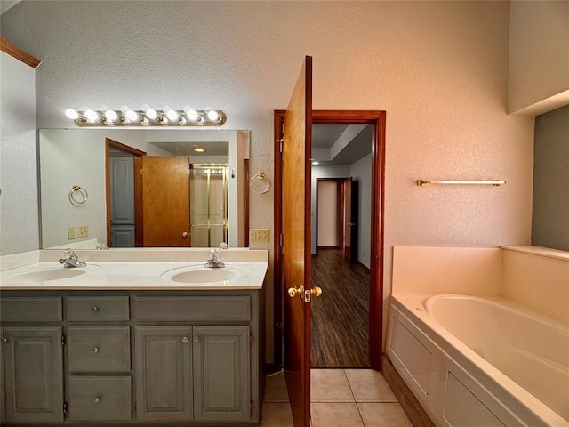 bathroom featuring vanity, tile patterned floors, and independent shower and bath