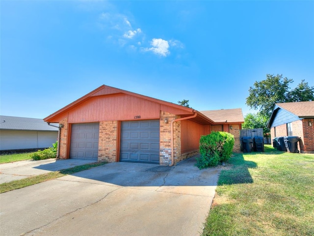 ranch-style home with a front yard and a garage