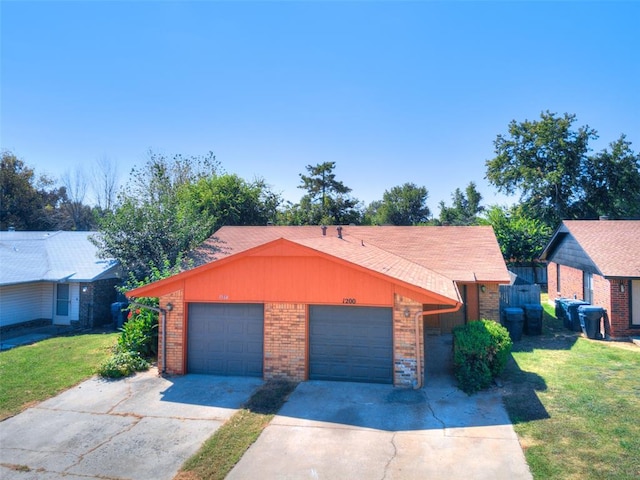 ranch-style house with a garage and a front lawn