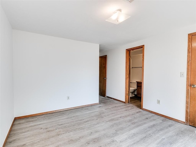 unfurnished room with light hardwood / wood-style flooring