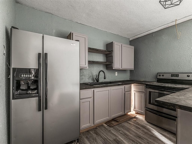 kitchen featuring sink, dark wood-type flooring, gray cabinets, and stainless steel appliances