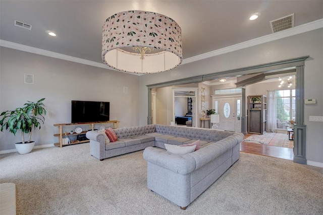 living room with carpet floors and ornamental molding