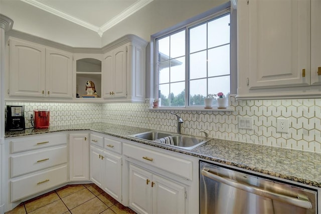 kitchen with dishwasher, sink, ornamental molding, light tile patterned flooring, and white cabinetry