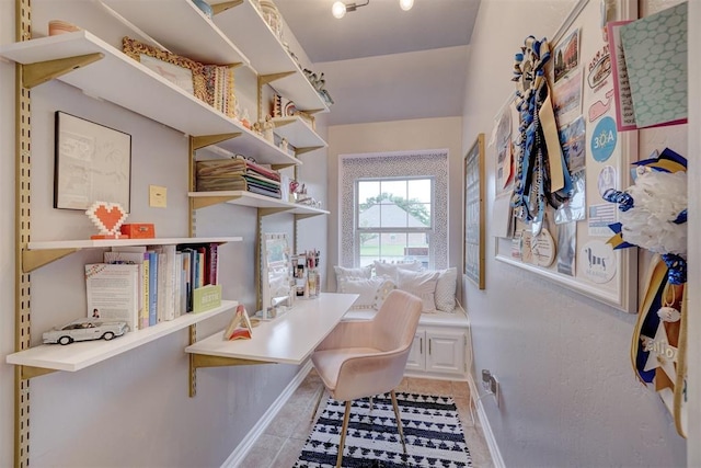 home office with light tile patterned floors