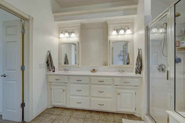 bathroom featuring tile patterned flooring, vanity, and a shower with shower door