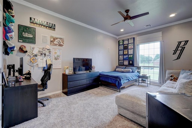 bedroom with carpet flooring, ceiling fan, and crown molding