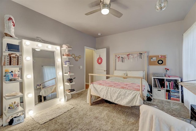 carpeted bedroom featuring ceiling fan