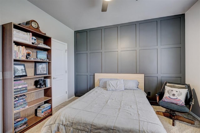 bedroom featuring light colored carpet and ceiling fan