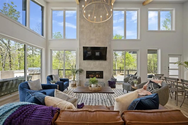 sunroom with a fireplace and a healthy amount of sunlight