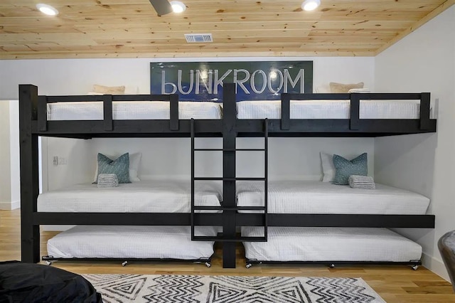 bedroom with wood-type flooring and wooden ceiling