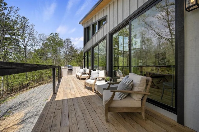 deck featuring outdoor lounge area