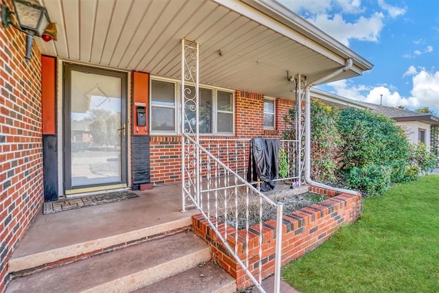 entrance to property featuring covered porch