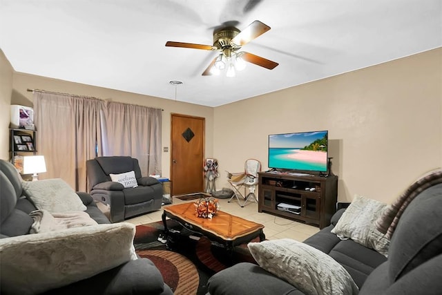 living room featuring ceiling fan and light tile patterned floors